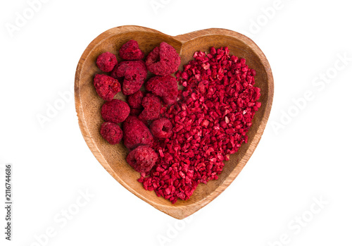  Heart-shaped bowl with dried raspberries on a white background