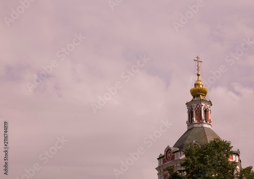  Church dome with a cross against a light sky
