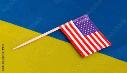 Small US flag on the flag of Ukraine 