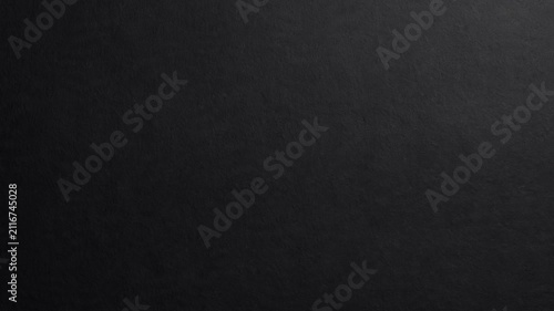 High resolution dark charcoal gray surface featuring a subtle grainy texture and matte finish. Perfect for minimalist design, product mockups, or modern digital aesthetics requiring a clean 