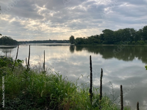 reflections of clouds in the river at sunrise