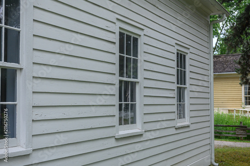 Side view of a white vintage wooden house
