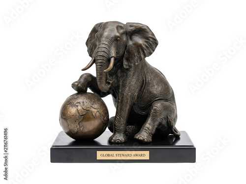 Bild auf Leinwand Bronze elephant statue sitting next to a detailed world globe on a black base wi