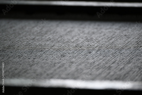 Close up of woven fabric on an industrial textile machine