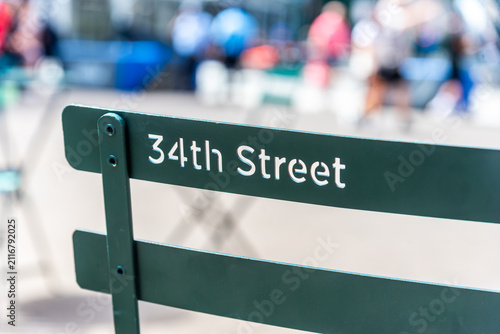 A public metal chair featuring the text 