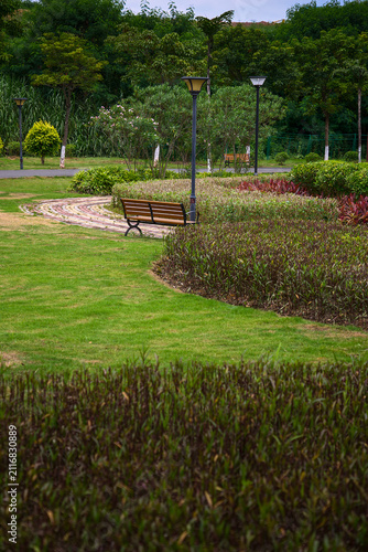 Vertical park lawn trail benches and green landscape