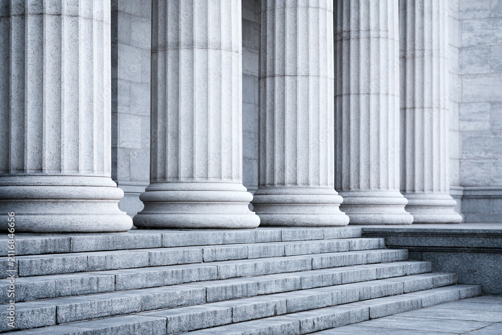 Obraz premium Majestic Stone Columns and Grand Staircase of an Imposing Classical Building Architecture