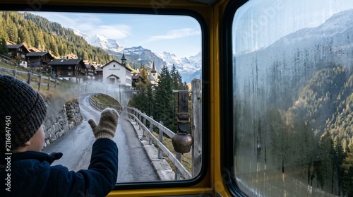 Child back to school journey on a Post-bus climbing an alpine mountain road view