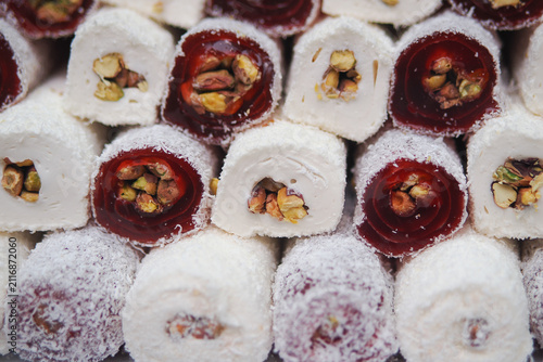 Obraz na płótnie Dessert display of turkish delight with nuts at a market
