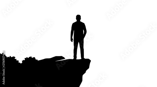 Silhouette of a Man Standing on a Cliff Edge Isolated on White