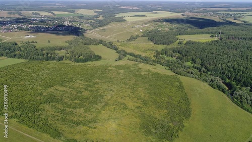 Elevated drone circle over countryside and village