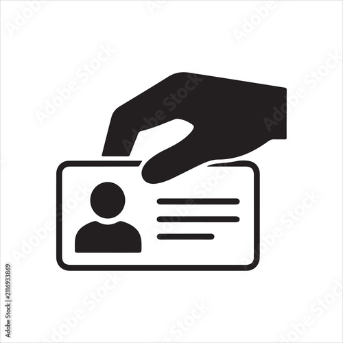 Hand holding identity card with personal photo for identification or access control system.