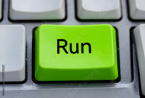 Green run button on a compu...