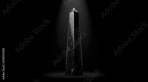 A towering black marble obelisk rises from the darkness illuminated by a single beam of light, a powerful metaphor for timeless wisdom, strength, and monumental achievement.