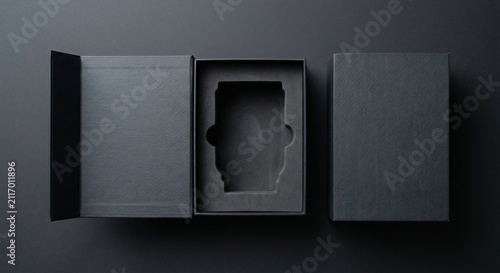 Black gift box open and closed showing foam insert on dark background