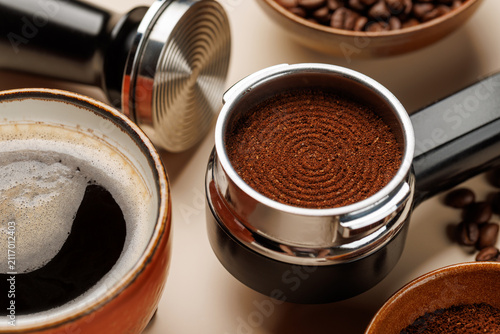 Close up of fresh ground coffee in portafilter for espresso machine