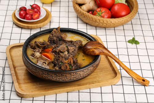 Konstfotografi Mongolian Lamb Stew with Spinal Meat and Vegetables in Traditional Bowl