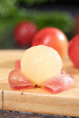 Peeled Seedless Grapes with Red Tomatoes on Wooden Board - Fresh Fruit Food Photography