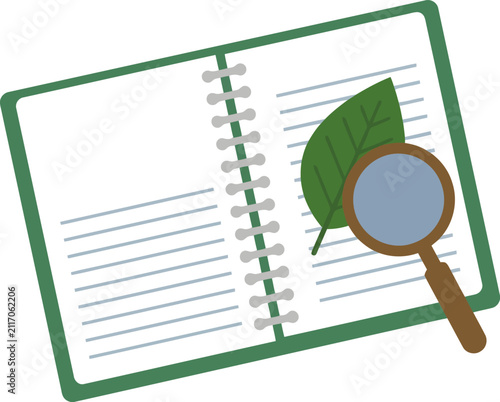 Open notebook with a leaf and a magnifying glass