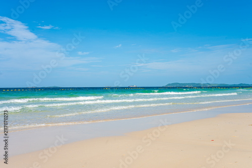 White sand beach wave sea background blue sky with fuffy cloud