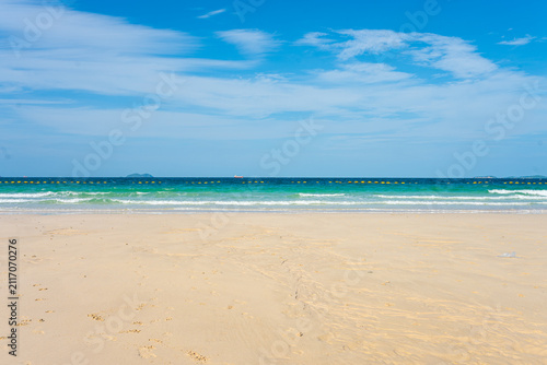 White sand beach wave sea background blue sky with fuffy cloud