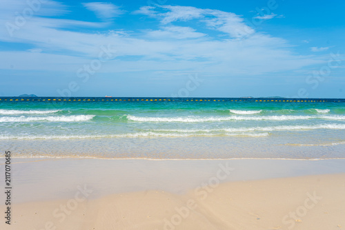 White sand beach wave sea background blue sky with fuffy cloud