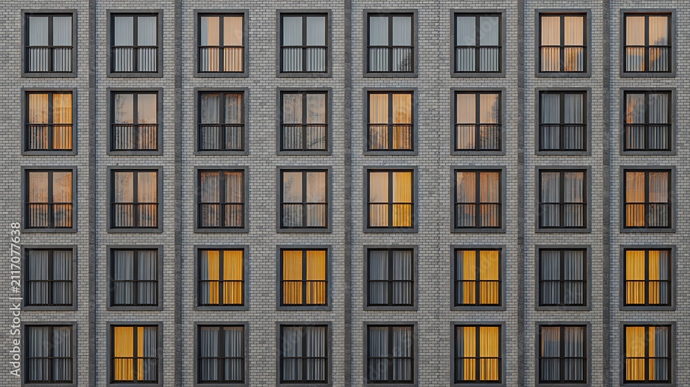 Fototapeta premium Residential apartment building facade with repeating windows and modern urban architecture