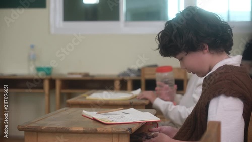 The young children are learning in the classroom.