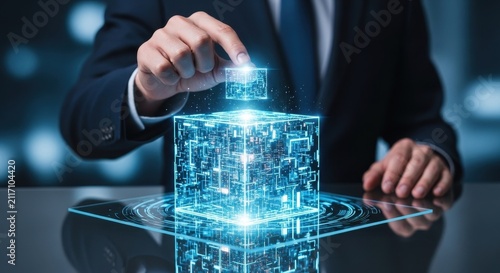 Business person constructing a glowing digital cube. Concept of innovation and futuristic technology development.