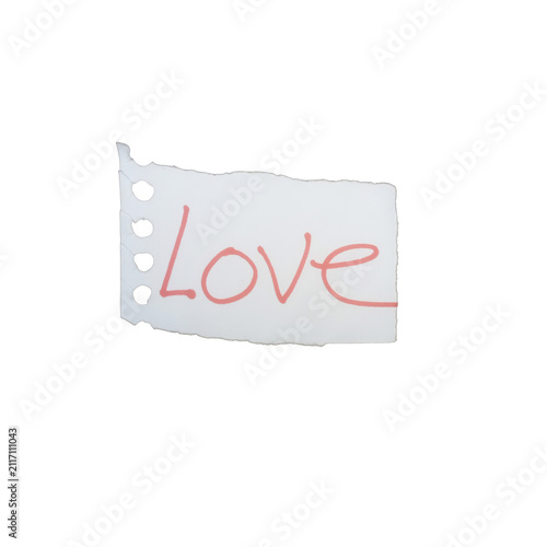 Принти на полотні Small torn piece of paper with the handwritten word love in red ink isolated on