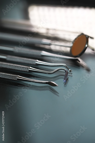 Dental Tools on Reflective Surface: Close-Up of Instruments in a Modern Dental Office