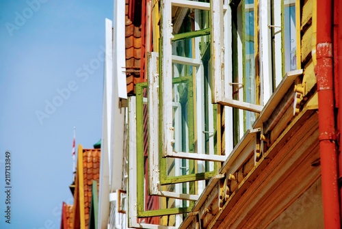 Colorful open window shutters of hanseatic houses of Bergen Bryggen, Norway