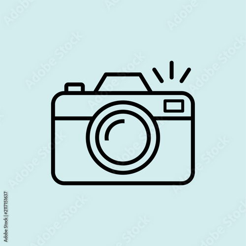 Vector line icon of a digital camera with flash. Symbol for travel photography, capturing memories, and sightseeing.
