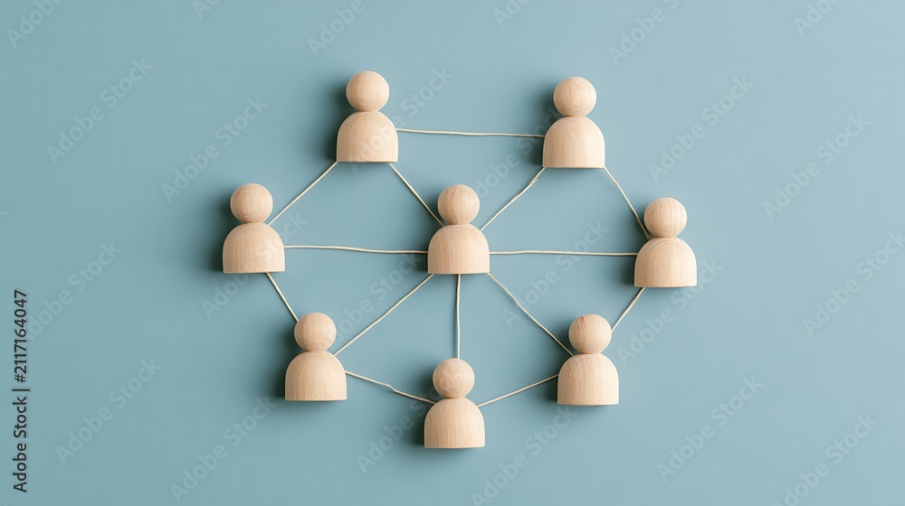 Obraz premium Wooden figures connected by lines on blue. Conceptual model representing business networking and teamwork.