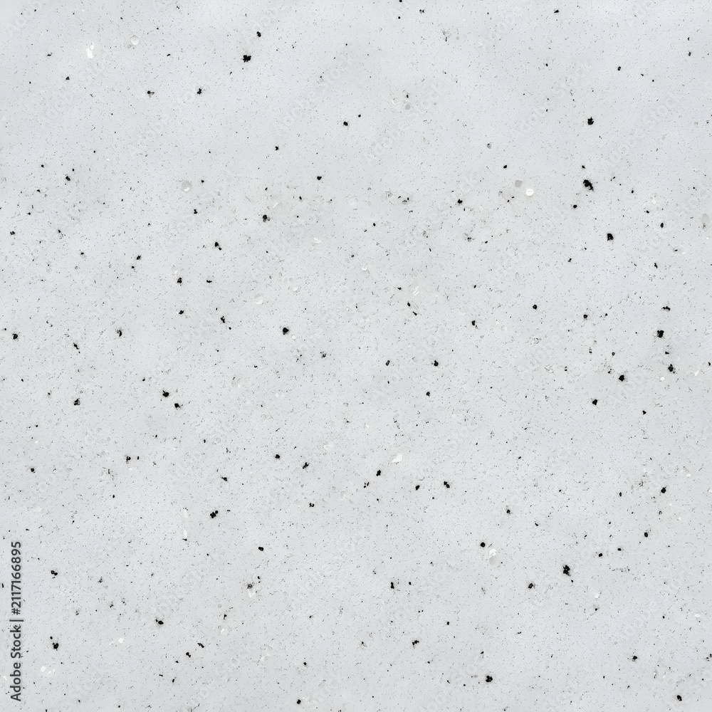 Naklejka premium White quartz stone texture background, polished light gray terrazzo surface with fine black speckles for modern interior design and kitchen countertops