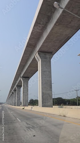 Driving in highway and elevated railway. Lopburi Province, Thailand.