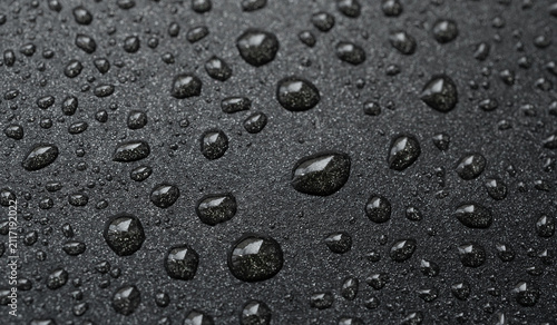 Fotografía Oil drops on frying pan texture, water splash pattern on black non-stick coating