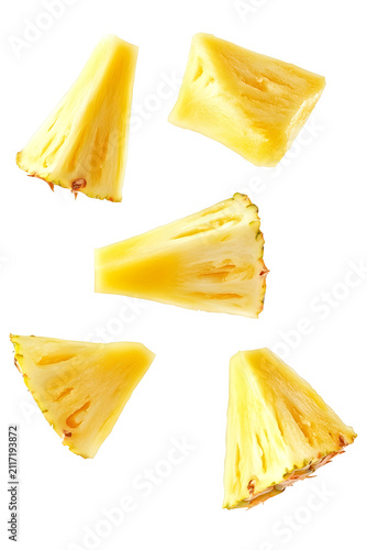 Flying fresh pineapple wedges falling on transparent background for food advertisement set.