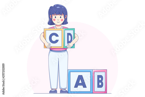 Young school girl holding alphabet blocks for early childhood education and literacy learning