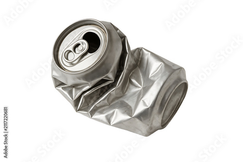 Smashed crumpled blank silver tin beverage can object sitting isolated on a dark background for sustainability and garbage reduction concepts