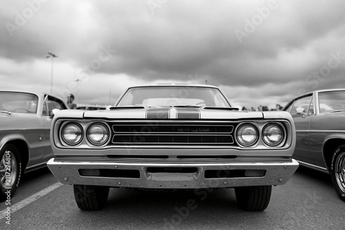 The Classic Muscle Car Front View at a Vintage Car Show Parking Lot