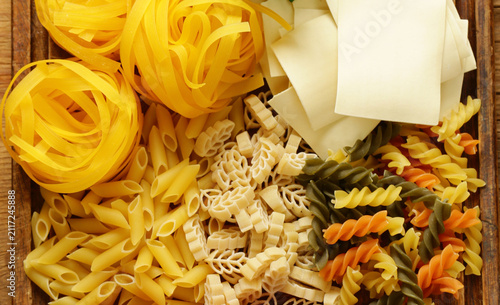 Various types of pasta (spaghetti, penne, fusilli)
