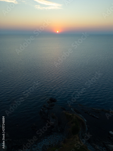 Drone Flying Forward Over Silistar Beach Bay at Golden Sunrise Sunset