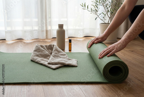 Individual Preparing Green Exercise Mat Within A Bright Minimalist Home Studio