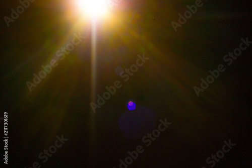 Sun flare on the black background