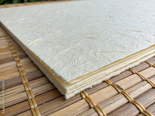 A high quality close up view of a natural white handmade paper texture surface background