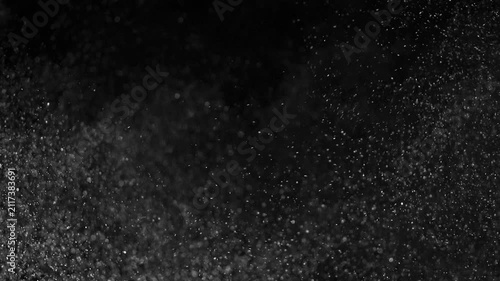Overlay of different scenes with a multitude of dust particles filling the screen, against a black background