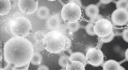 Halftone dot artwork with round shapes and soft gradients creating abstract organic forms in black and white for graphic design projects.