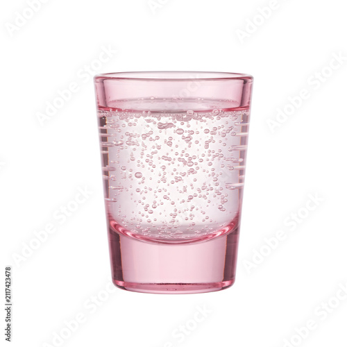 Rose pink shot glass with sparkling liquid and air bubbles, transparent drinkware isolated on transparent background