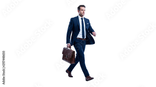 Successful Businessman in Navy Blue Suit Walking with Leather Briefcase Isolated